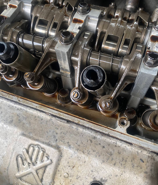Close-up of an engine's camshafts and valve train during a repair